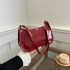 Foreign trade new small bag female 2024 summer retro handheld foreign-style armpit bag patent leather pure color glossy baguette baguette